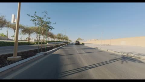 Car Driving on Modern City Street Daytime Video Footage