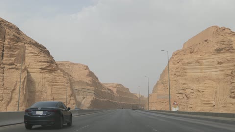Vehicles Driving On Desert Highway Canyon Road Saudi Arabia