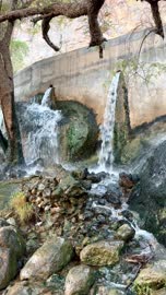 Water Flowing Over Rocks in Nizwa Oman Vertical Video
