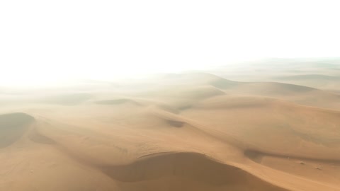 Aerial Drone Flight Over Foggy Arabian Desert Dunes