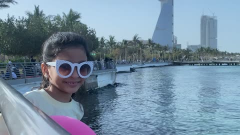 Smiling Girl in Sunglasses at Jeddah Corniche Waterfront