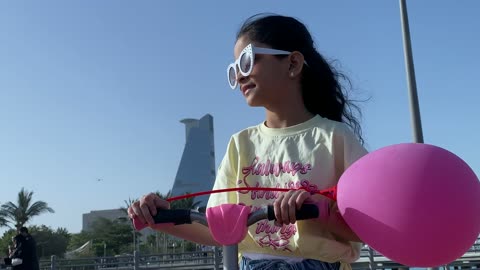 Young Saudi Girl Riding Scooter on Jeddah Corniche Waterfront