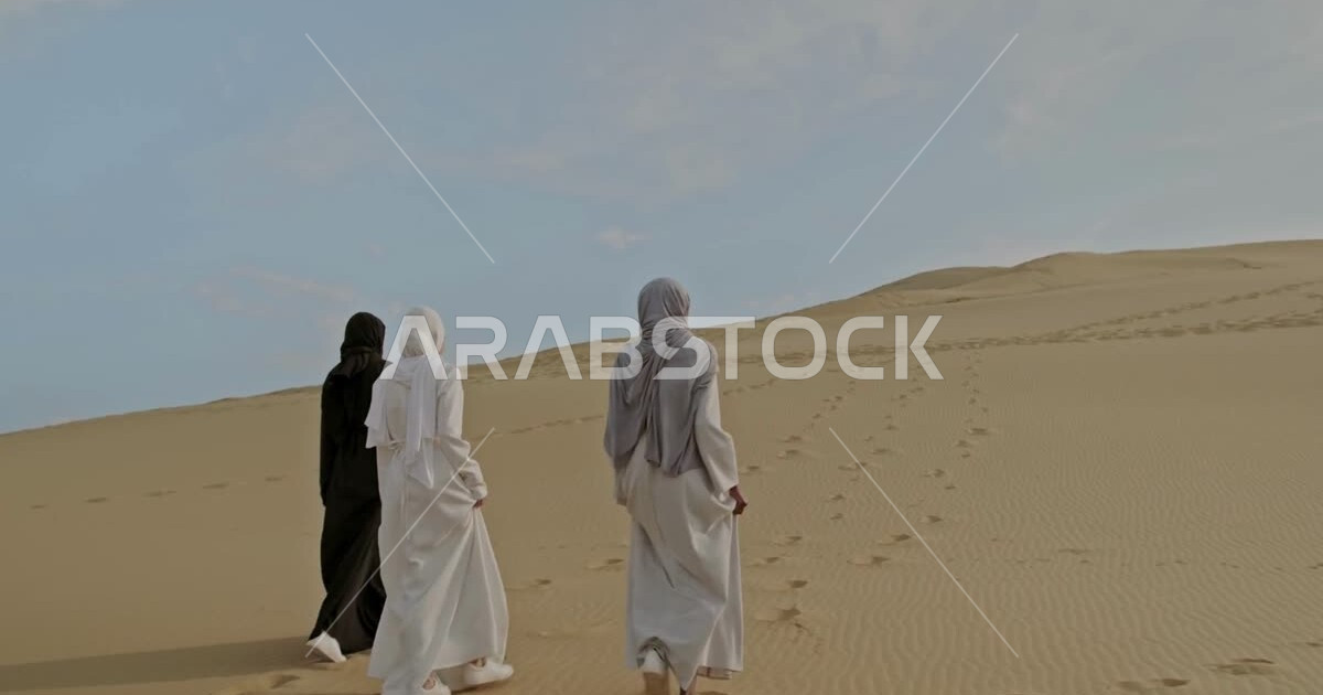 Photography from behind for a group of Saudi Arabian Gulf women in the