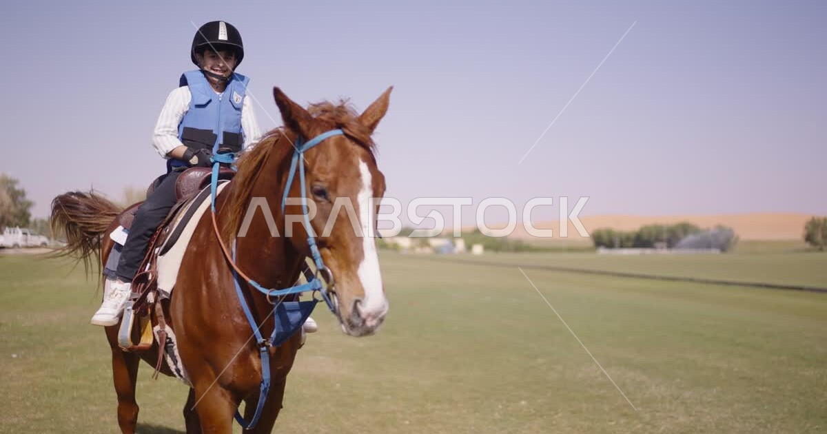 A Saudi Arabian Gulf boy riding horses, purebred Arabian horses, horse